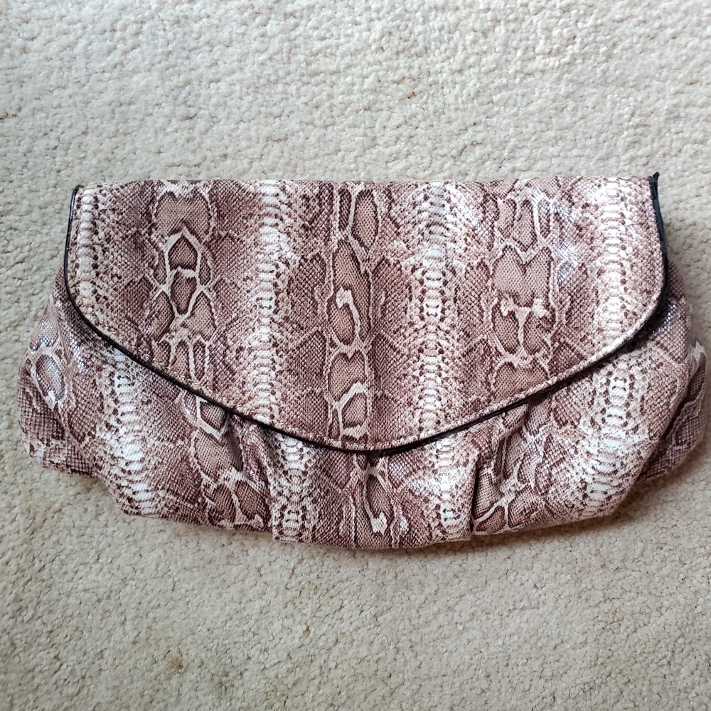Chico's faux snakeskin clutch. Brown shades with brown satin lining.